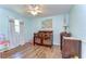 Charming Bedroom with wood crib, light blue walls, and decorative artwork at 9303 Alice Ln, Riverview, FL 33578