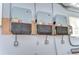 Garage with solar system inverter mounted on the wall at 9303 Alice Ln, Riverview, FL 33578