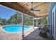 Relax by the pool with covered patio and scenic lake views at 9303 Alice Ln, Riverview, FL 33578
