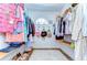 Spacious walk-in closet with ample storage and clothing racks, perfect for organization at 9303 Alice Ln, Riverview, FL 33578