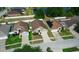 A neighborhood aerial view showcases well-maintained homes and landscaping near a tranquil pond at 944 Ridge Haven Dr, Brandon, FL 33511