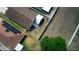 Aerial backyard view with green space between the houses and small trees at 944 Ridge Haven Dr, Brandon, FL 33511