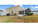 The backyard features a screened-in porch area that sits on the corner of the home and includes a fire pit at 944 Ridge Haven Dr, Brandon, FL 33511