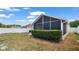 The backyard features a screened-in porch area that sits on the corner of the home at 944 Ridge Haven Dr, Brandon, FL 33511