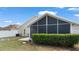 The backyard features a screened-in porch area that sits on the corner of the home at 944 Ridge Haven Dr, Brandon, FL 33511