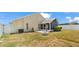 The backyard features a screened-in porch area that sits on the corner of the home and includes a fire pit at 944 Ridge Haven Dr, Brandon, FL 33511