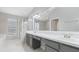 A well-lit bathroom featuring a glass shower, tub, and vanity with sink and storage at 944 Ridge Haven Dr, Brandon, FL 33511