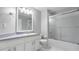 A bathroom featuring a vanity with countertop space and a glass-enclosed shower with tub at 944 Ridge Haven Dr, Brandon, FL 33511