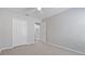 Comfortable bedroom features carpeted flooring, closet, ceiling fan, and attached bathroom access at 944 Ridge Haven Dr, Brandon, FL 33511
