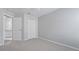 This cozy bedroom features neutral walls, plush carpeting, and a convenient closet, offering a serene retreat at 944 Ridge Haven Dr, Brandon, FL 33511