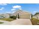 Charming single-story home featuring a two-car garage, well-maintained lawn, and tasteful landscaping at 944 Ridge Haven Dr, Brandon, FL 33511