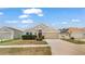 Beautifully maintained one-story home with a two-car garage, mature shrubs, and classic design elements at 944 Ridge Haven Dr, Brandon, FL 33511