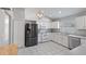 Bright kitchen features stainless steel appliances, white cabinets, and tile flooring at 944 Ridge Haven Dr, Brandon, FL 33511