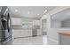 Open-concept kitchen showcases stainless steel appliances and ample counter space at 944 Ridge Haven Dr, Brandon, FL 33511