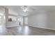 Expansive living room with lots of natural light and grey wood laminate flooring at 944 Ridge Haven Dr, Brandon, FL 33511