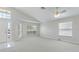 Open living area with carpet, natural light from multiple windows, and a ceiling fan at 944 Ridge Haven Dr, Brandon, FL 33511
