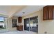 Enclosed patio with built-in cabinets and sliding glass doors to the interior at 944 Ridge Haven Dr, Brandon, FL 33511