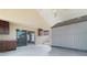 Enclosed patio with a ceiling fan and includes a shed for storage. Sliding glass doors to the interior at 944 Ridge Haven Dr, Brandon, FL 33511