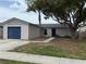 Charming one-story home with a well-maintained front yard and attached garage at 1010 Lochmont Dr, Brandon, FL 33511