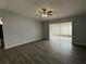 Spacious living room with hardwood floors and sliding glass doors for natural light at 1010 Lochmont Dr, Brandon, FL 33511