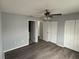 Comfortable main bedroom featuring wood-look floors and ample closet space for storage at 1010 Lochmont Dr, Brandon, FL 33511