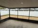 Screened-in patio, providing an ideal outdoor living space with a view of the fenced backyard at 1010 Lochmont Dr, Brandon, FL 33511