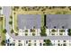 Overhead view of townhome community showcases mature trees, driveways, and landscaping at 10127 Newel Valley Loop, Riverview, FL 33569