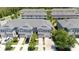 Gorgeous aerial view of the townhome community featuring private driveways and landscaping at 10127 Newel Valley Loop, Riverview, FL 33569