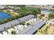 Beautiful aerial view of community homes near a tranquil lake and lush greenery at 10127 Newel Valley Loop, Riverview, FL 33569