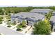 Stunning aerial view of the townhome community with lush landscaping and private driveways at 10127 Newel Valley Loop, Riverview, FL 33569