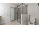 Bathroom featuring walk-in shower, toilet, and a door to the bedroom at 10127 Newel Valley Loop, Riverview, FL 33569