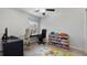 Bedroom/Office includes natural light, storage for toys, and laminate flooring at 10127 Newel Valley Loop, Riverview, FL 33569