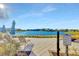 Lakeside outdoor seating area with Adirondack chairs and community fireplace at 10127 Newel Valley Loop, Riverview, FL 33569