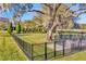 Fully fenced community dog park featuring mature trees and well-maintained green space at 10127 Newel Valley Loop, Riverview, FL 33569