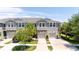 Inviting home exterior with two-car garage and meticulously manicured landscaping at 10127 Newel Valley Loop, Riverview, FL 33569