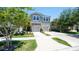 Inviting two-story townhouse with a well-maintained lawn and a two-car garage at 10127 Newel Valley Loop, Riverview, FL 33569