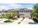 Well-maintained home exterior with a spacious two-car garage and manicured front yard at 10127 Newel Valley Loop, Riverview, FL 33569