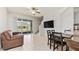 Open living area with tile flooring, a sliding glass door and neutral decor at 10127 Newel Valley Loop, Riverview, FL 33569