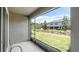 Relax on this screened patio overlooking a pristine lawn and beautiful landscaping at 10127 Newel Valley Loop, Riverview, FL 33569