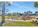 Fun playground with swings, slides, and picnic tables in a green, sunny setting at 10127 Newel Valley Loop, Riverview, FL 33569