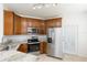 Modern kitchen features stainless steel appliances and ample cabinet space at 10502 Villa View Cir, Tampa, FL 33647