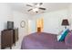 Cozy bedroom features a ceiling fan, ample space, and an attached bathroom for convenience and privacy at 10502 Villa View Cir, Tampa, FL 33647