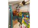 Well-organized closet featuring shelves, rods, and storage boxes, providing ample space and efficient organization at 10502 Villa View Cir, Tampa, FL 33647