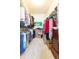 Walk-in closet featuring ample storage shelves, clothes rods, and boxes, maximizing space and organization at 10502 Villa View Cir, Tampa, FL 33647