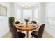 Bright dining area with a bay window, perfect for entertaining or intimate meals at 10502 Villa View Cir, Tampa, FL 33647