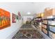 Organized garage with shelving, storage boxes, and artistic decor, providing both functionality and aesthetic appeal at 10502 Villa View Cir, Tampa, FL 33647