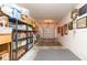 Attached garage with neutral walls, concrete floor, and overhead lighting offers ample storage and parking at 10502 Villa View Cir, Tampa, FL 33647