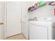 Functional laundry area with modern washer and dryer units for convenient laundry care at 10502 Villa View Cir, Tampa, FL 33647