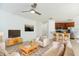 Inviting living room flows into the kitchen, featuring modern appliances and breakfast bar seating at 10502 Villa View Cir, Tampa, FL 33647