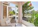 Relaxing screened porch provides views of lush landscaping and a serene pond at 10502 Villa View Cir, Tampa, FL 33647